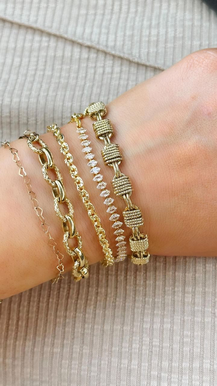 bracelet stack on models wrist with marquise bracelet
