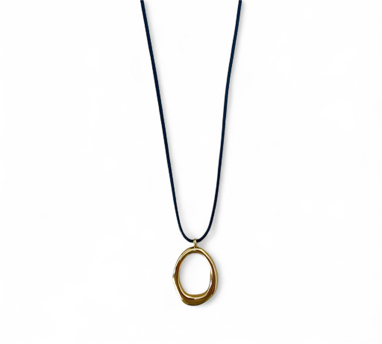 Necklace with a gold pendant on a black cord against a white background