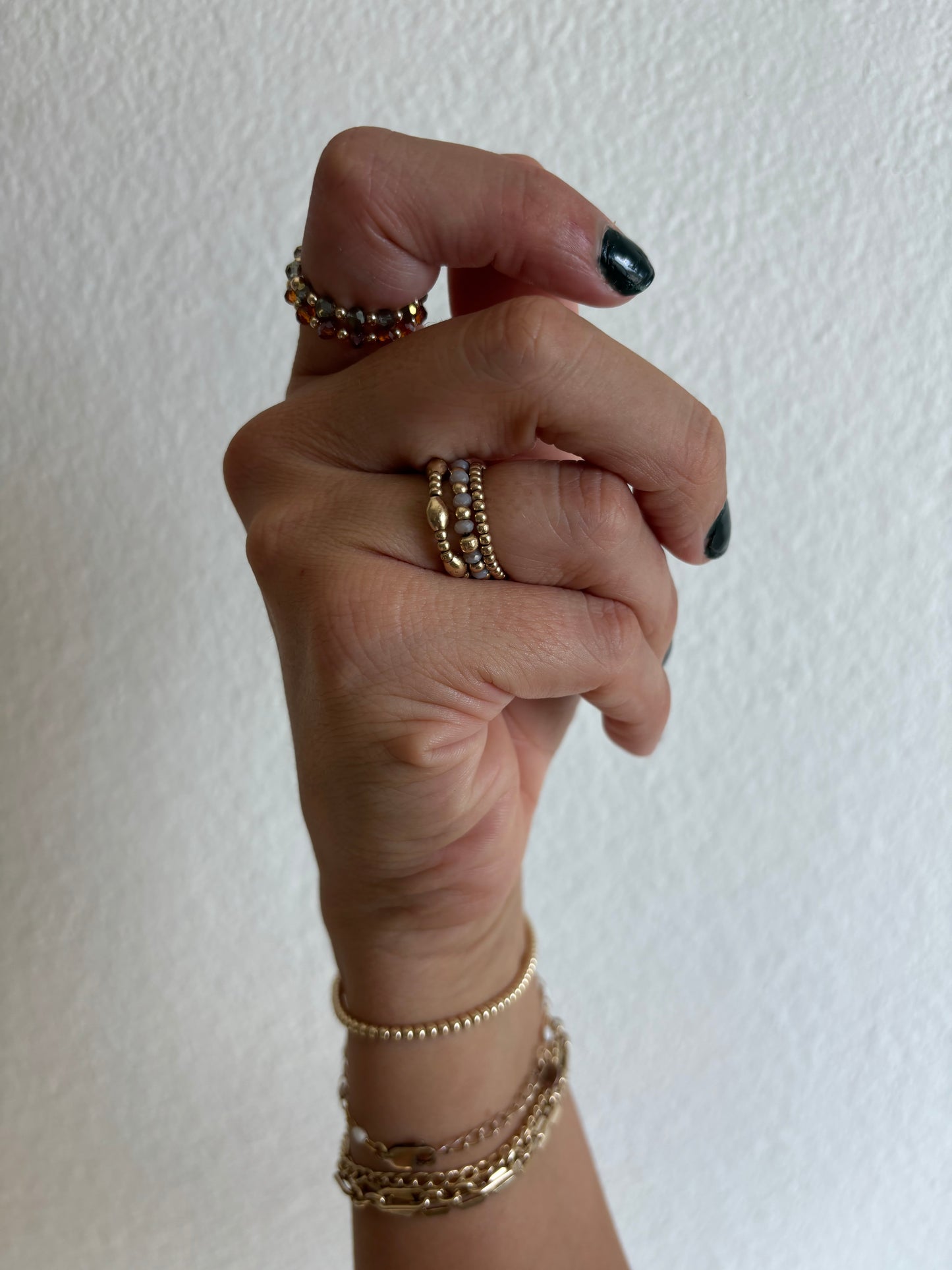 photo of hand with multiple rings modeled