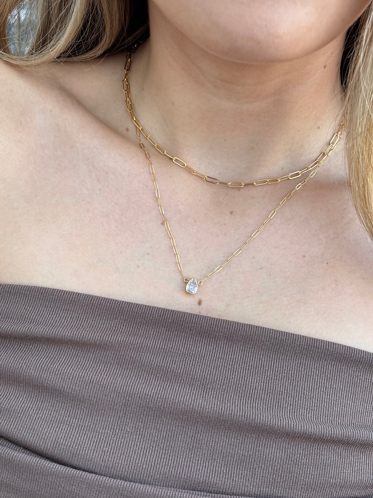 Model wearing the ainsley necklaced paired with the alexandra necklace