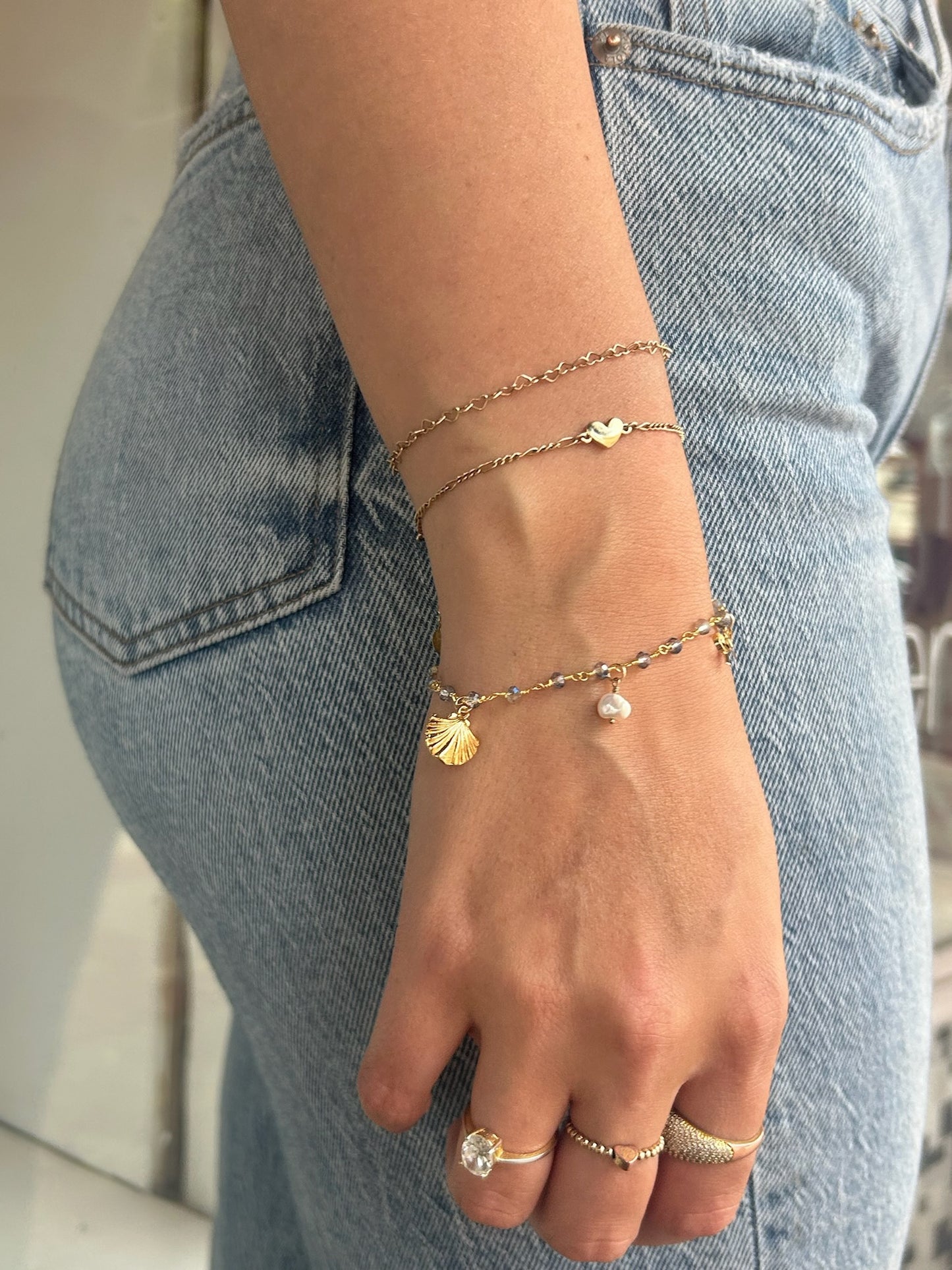 Dainty gold filled heart link bracelet on model