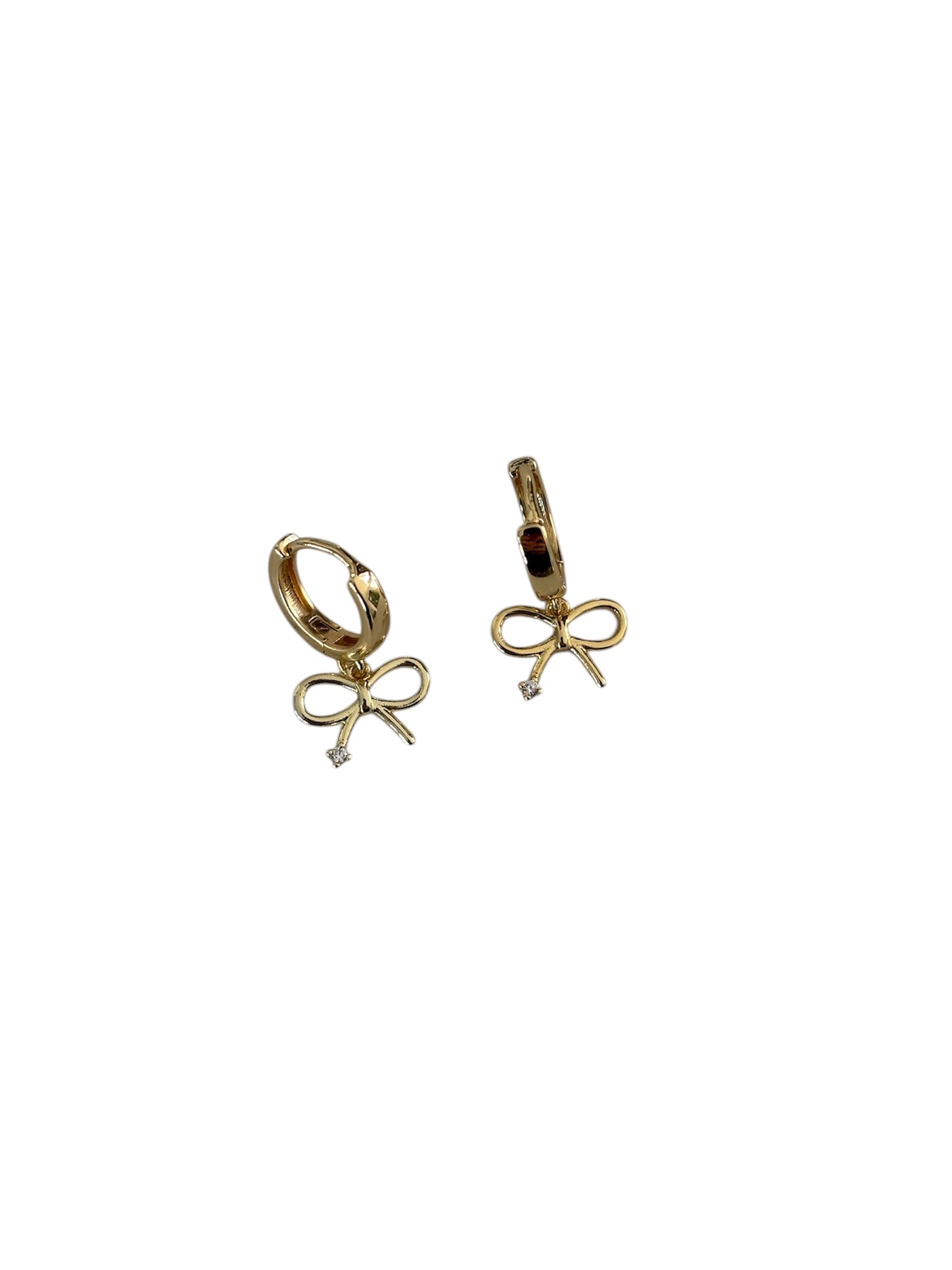 Close Up detail view of our BOW earring - gold huggies with a small bow charm