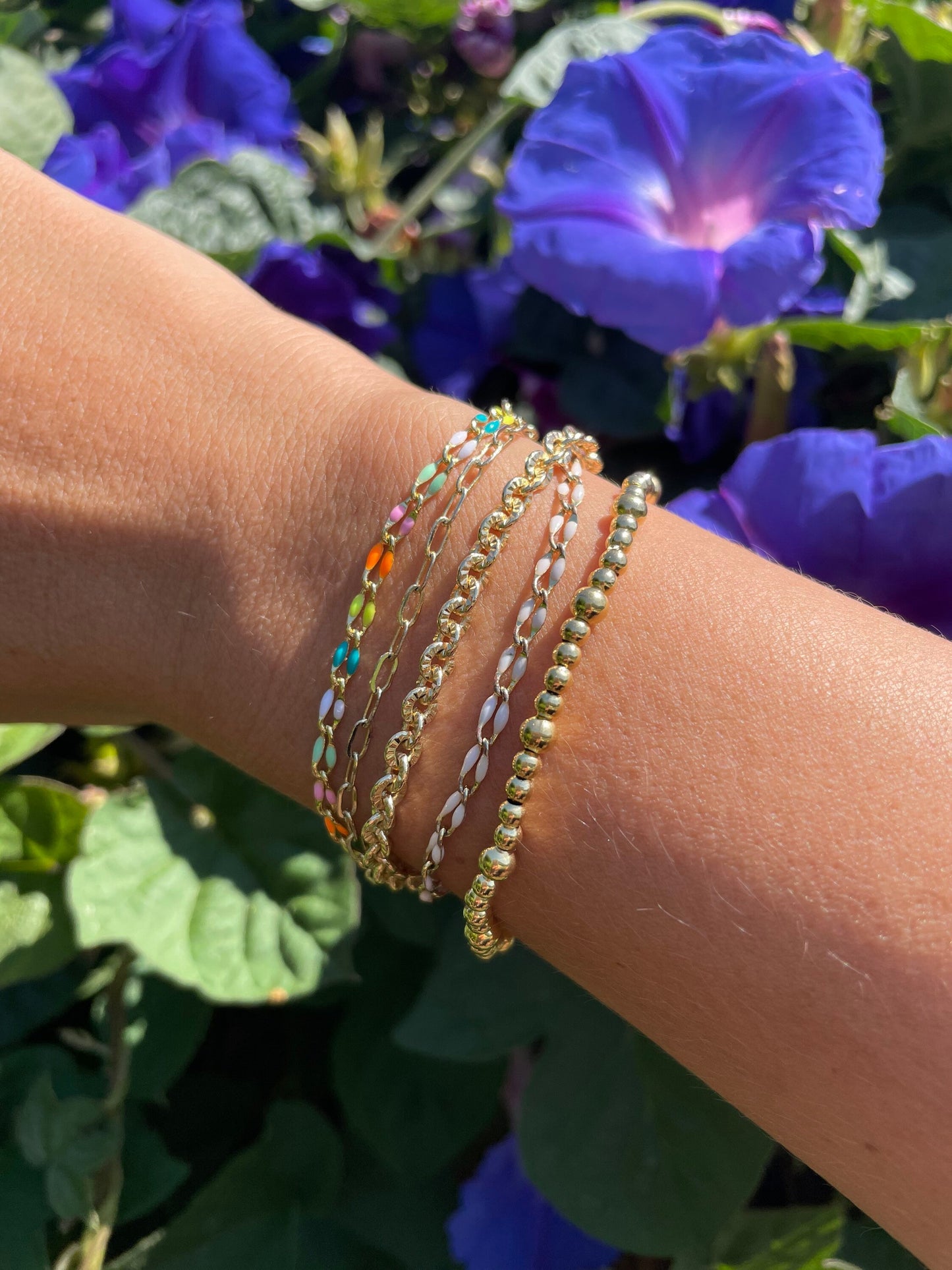 chunky circle chain bracelet stack with flower background