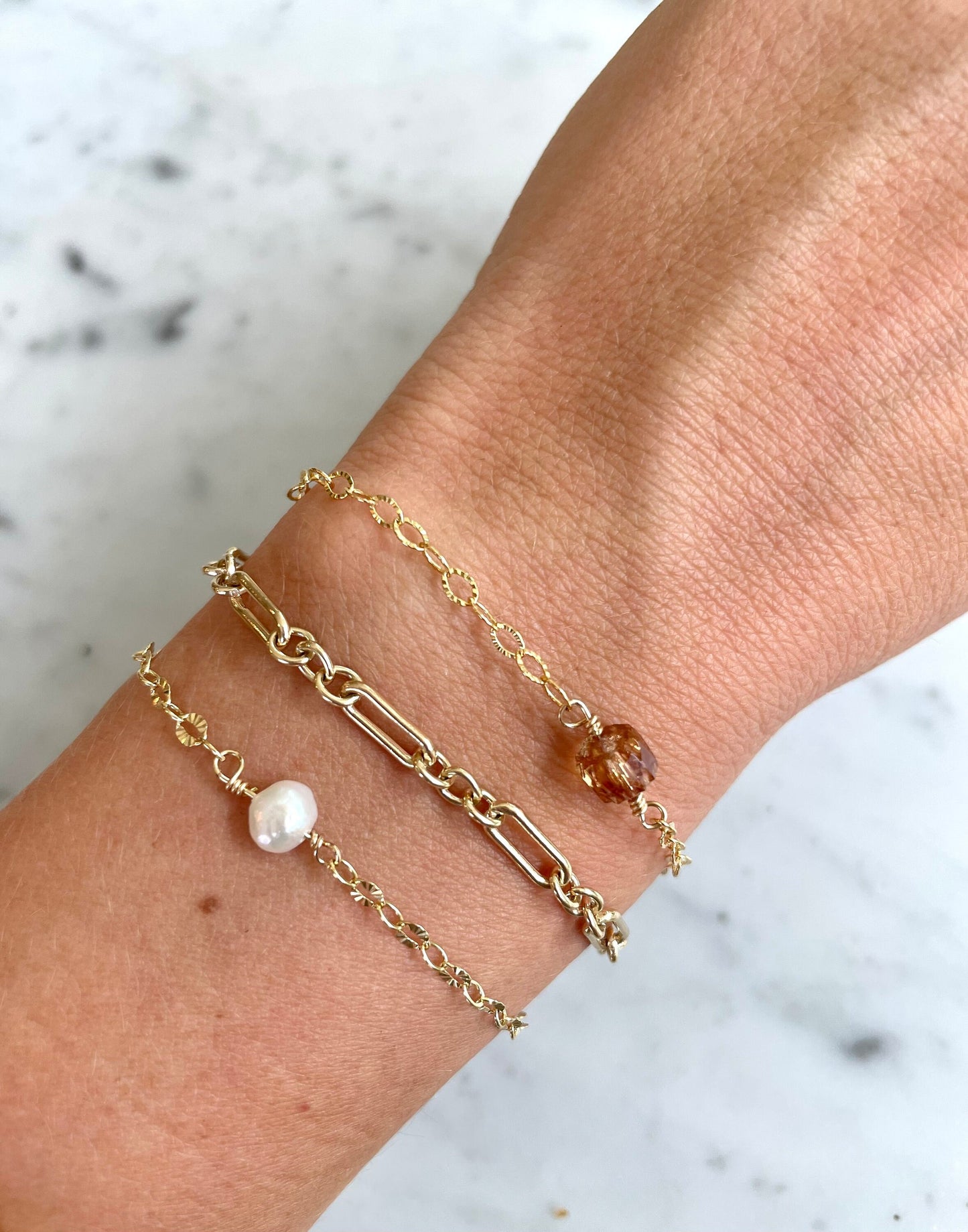 paris wired pearl and gold filled bracelet on wrist