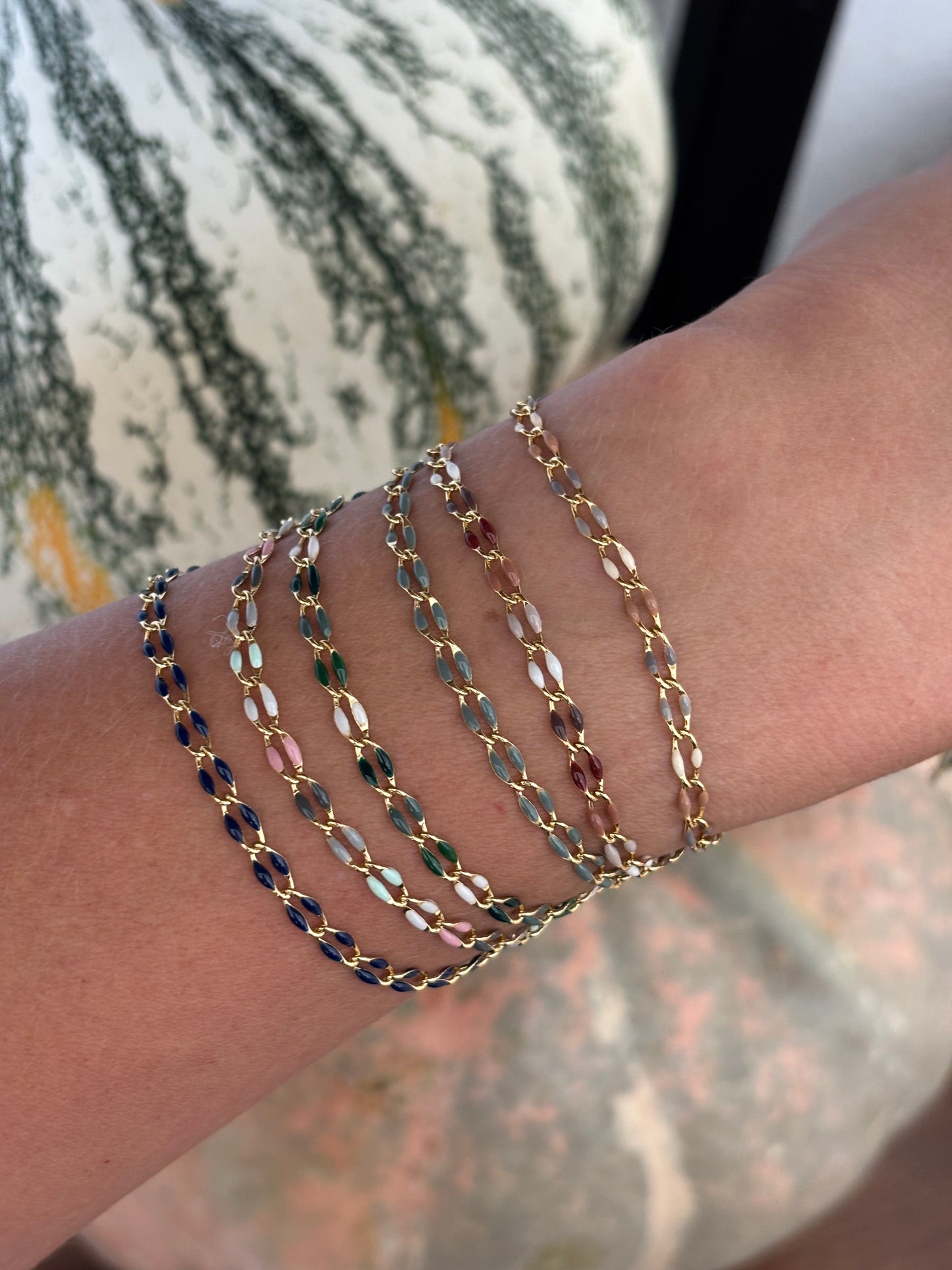 photo of bracelets on wrist with pumpkins in the background