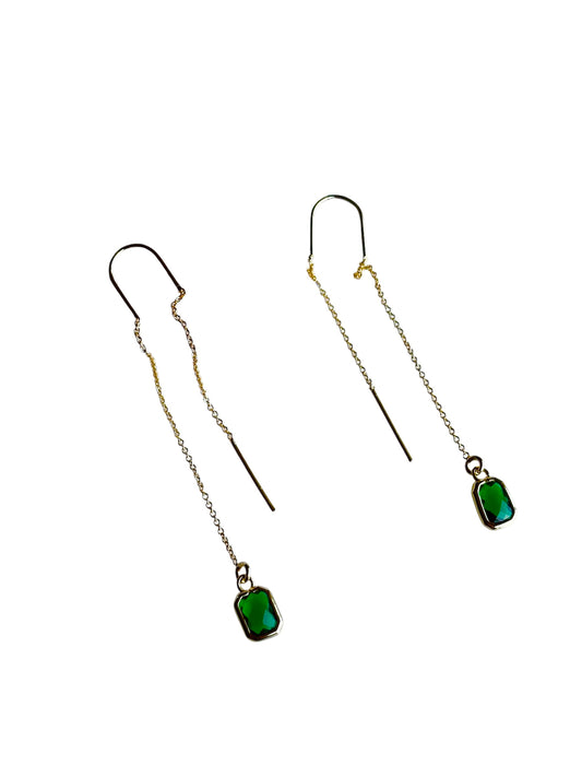 emerald drop earrings on white background