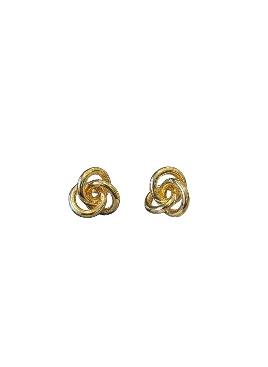 Pair of gold knot earrings on a white background