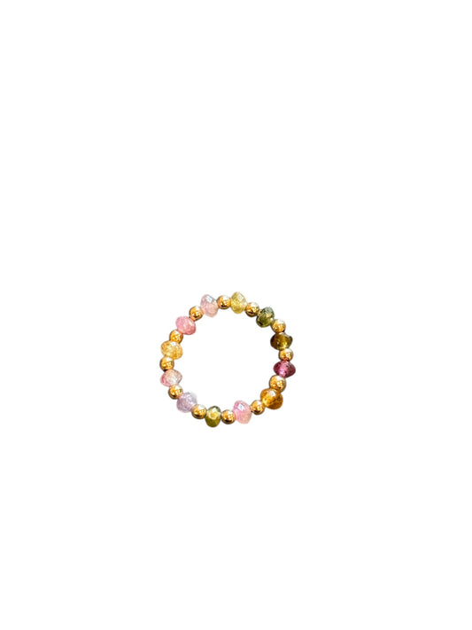 Multicolored beaded ring on a white background
