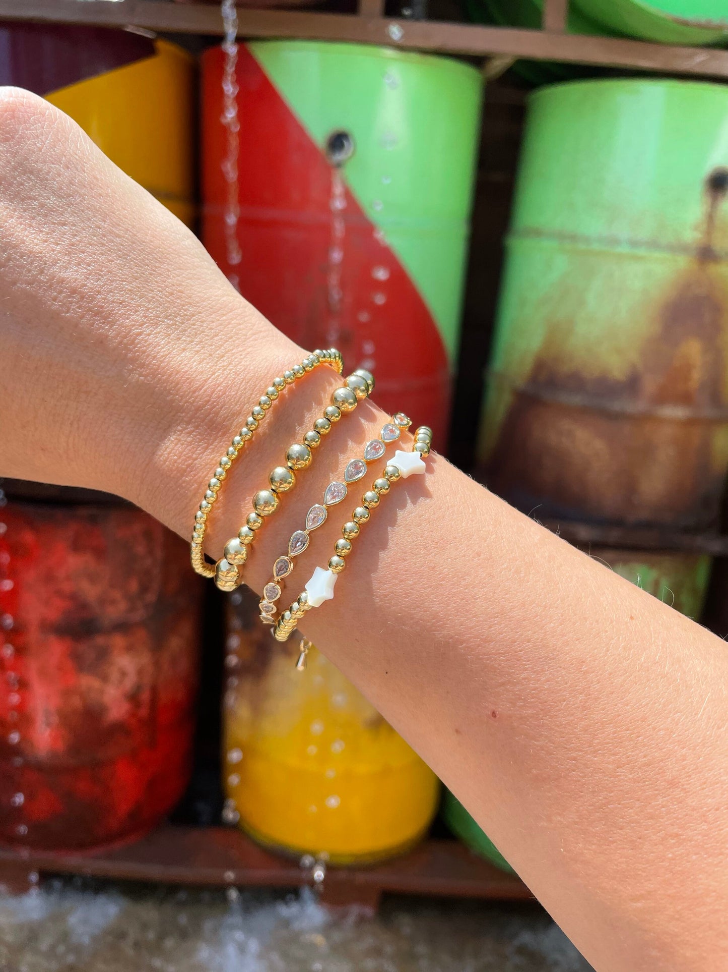 alternating gold bead bracelet stack