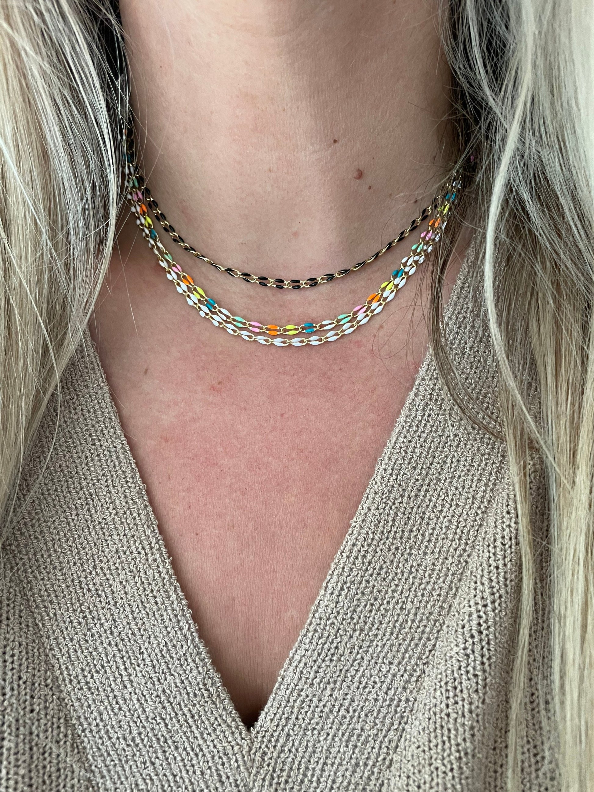 vibes colored enamel necklace on model
