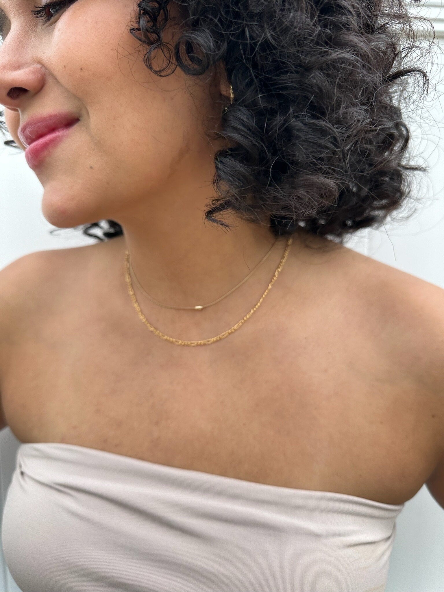 dainty gold filled snake chain on model